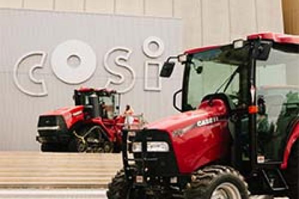 COSI during Farm Days event with tractors in front of building